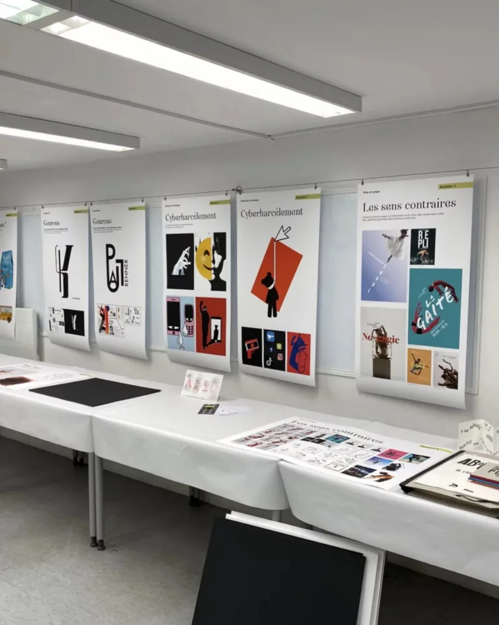 Student posters displayed in an exhibition room